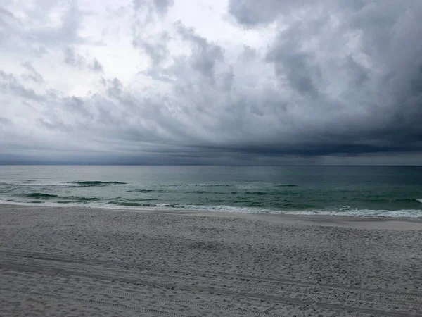 Dark ominous clouds over empty beach