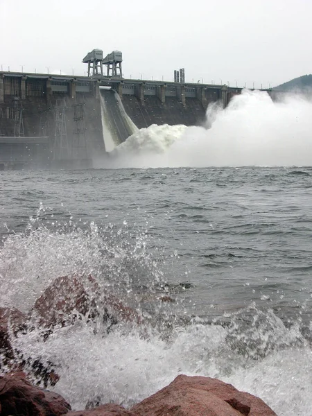 Water discharge at the Krasnoyarsk hydroelectric station. Hydroelectric power station. Flood.