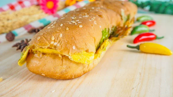 stock image Roti john is an omelette sandwich founded by a Malay. served on wooden cutting board