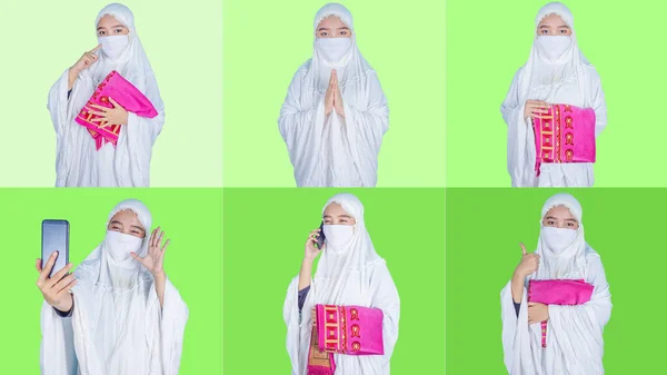 มสาวชาวเอเช ยสวมหน ากากแสดงความย และต อนร บแขกร บเช าหร Eid Mubarak — ภาพถ่ายสต็อก