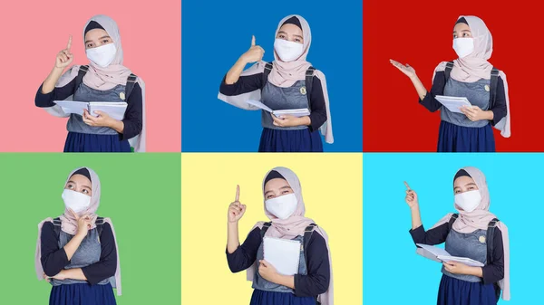医療用フェイスマスクをしたアジア系イスラム教徒の女子学生が学校にバッグや本を持って行きました — ストック写真