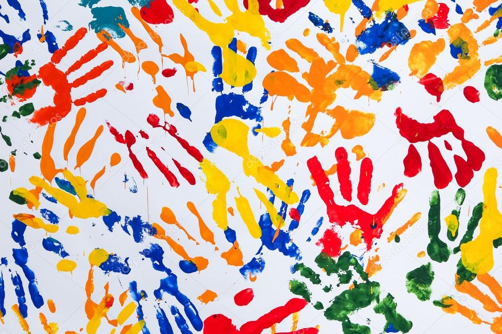 Colorful child hand prints on white background