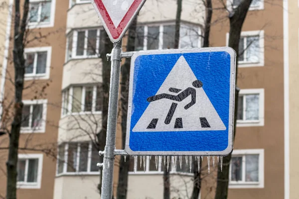 Road sign of pedestrian crossing covered with ice — Stock Photo, Image