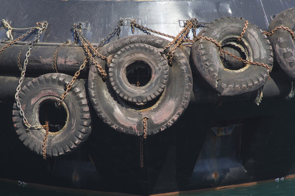 Tyres used like bumpers protecting a boat