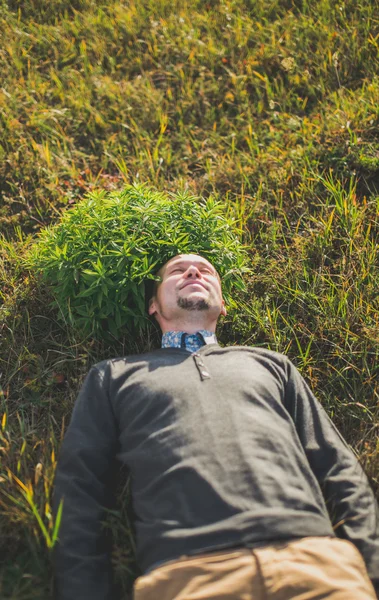 Portrait of a young man lying on the ground — Stock Photo, Image