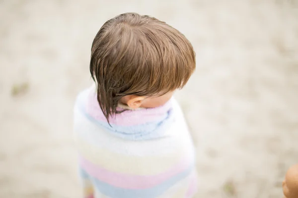 Little boy wrapped in towel at the lake on hot summer day — Stock Photo, Image