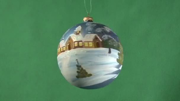 Christmas ball on a green background — Stock Video