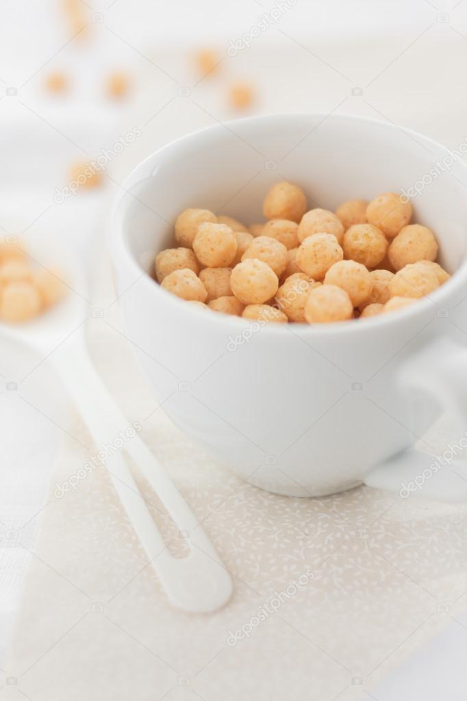 cup of round corn puffs