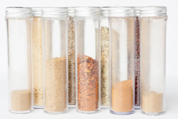 Assorted ground spices in bottles — Stock Photo, Image