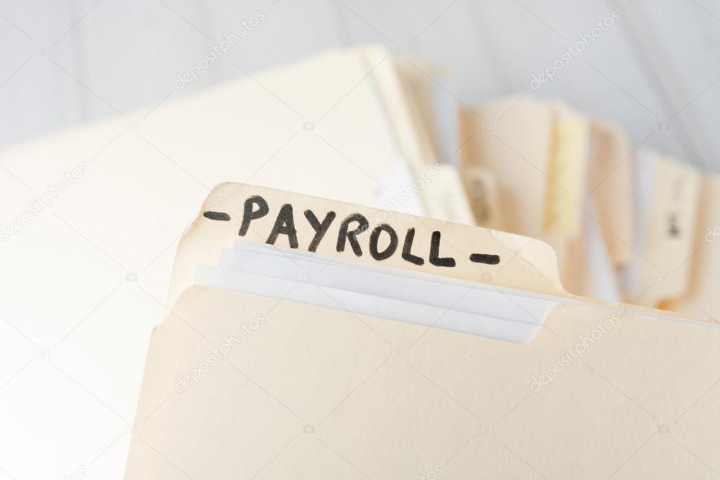 Yellow paper folder labeled PAYROLL Stock Photo by ©zoeytoja 70865989