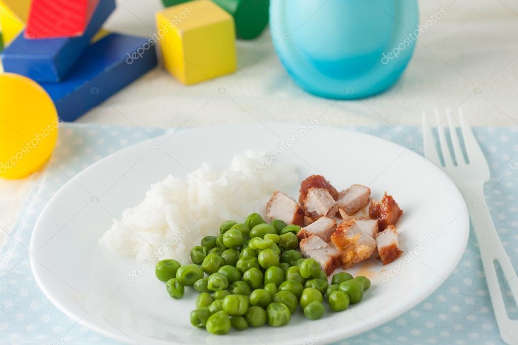 baby food: chopped cutlet and green peas