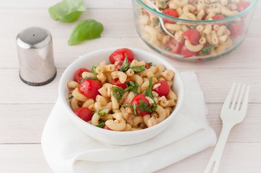 Italian macaroni salad with tomatoes and fresh basil