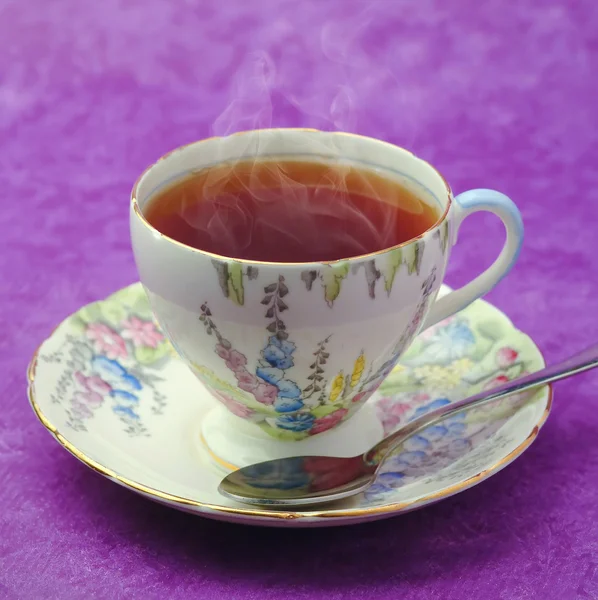Vintage cup of tea with smoke