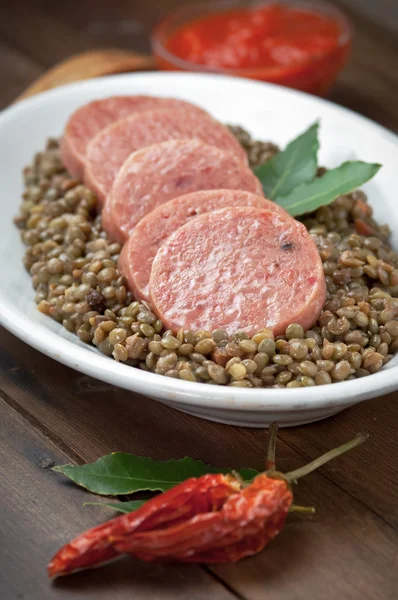 Italian cotechino with lentils — Stock Photo, Image