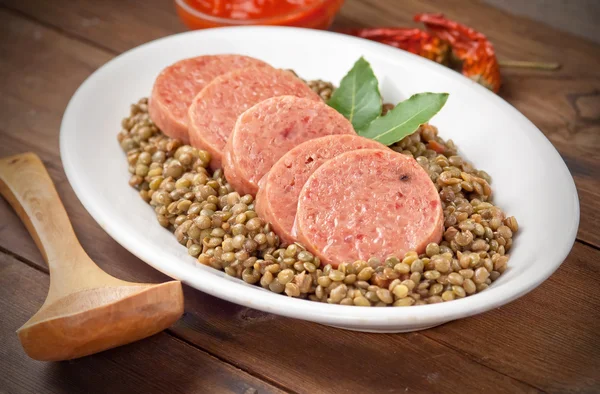 Italian cotechino with lentils — Stock Photo, Image