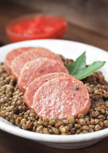 Italian cotechino with lentils — Stock Photo, Image