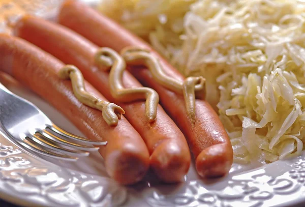 German wurstel sausages with krauts — Stock Image German wurstel sausages with krauts Royalty Free Stock Images