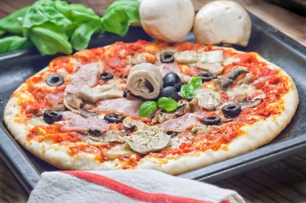 Pizza capricciosa ham olives and artichokes — Stock Photo, Image