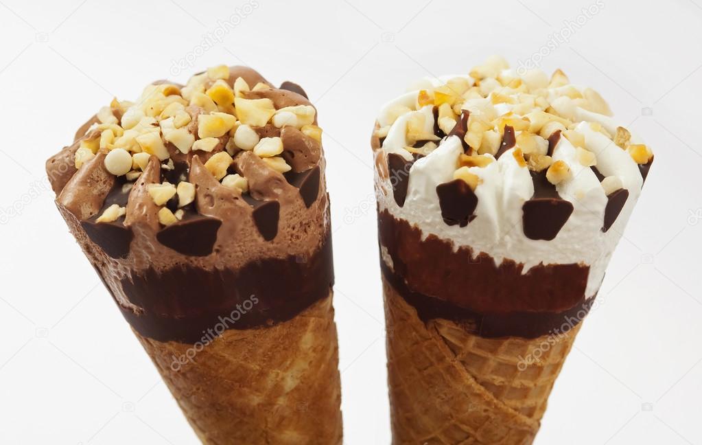 Two ice cream cones one of cream and the other of chocolate Stock 