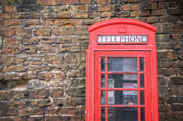 Old classic red telephone booth with copy space