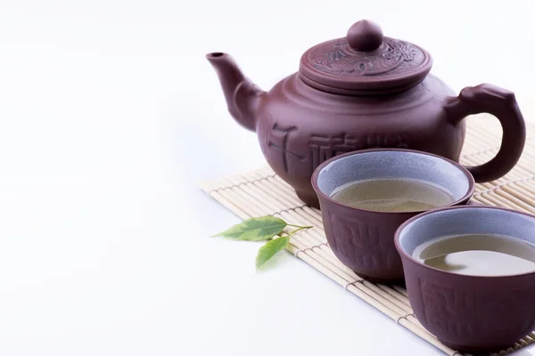 Green Tea set on a bamboo mat on white backgrond — Stock Photo, Image