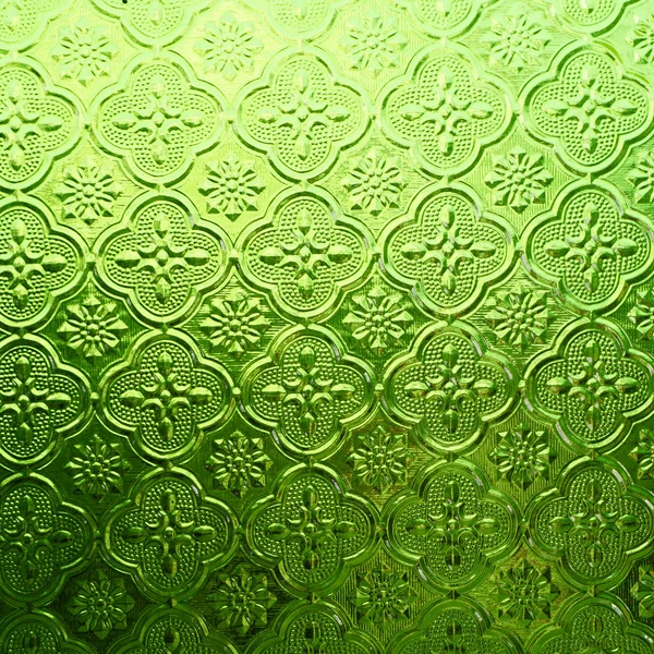 Зеленого цвета стекло с тайским узором — стоковое фото