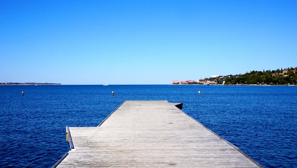 Bridge to the sea with blue sky — Stock Photo, Image