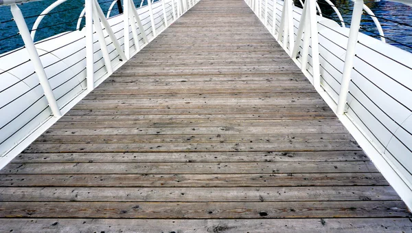 Wooden floor bridge and white railing over Danube river — Stock Photo, Image