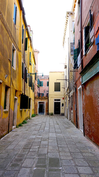 Alley with ancient building in Venice, Italy