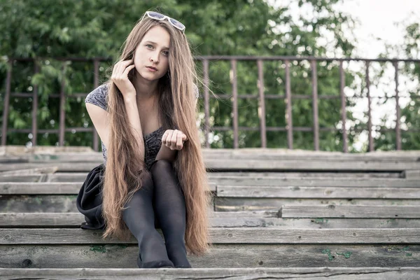 Portrait of a beautiful young sad hipster girl  outdoors — Stock Photo, Image