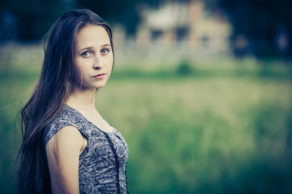 Portrait of a beautiful young sad hipster girl  outdoors — Stock Photo, Image