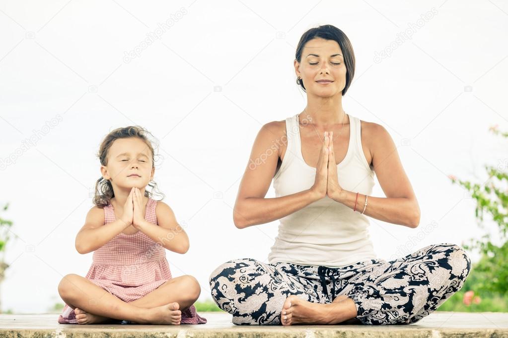 Yoga. Young woman doing yoga exercise outdoor