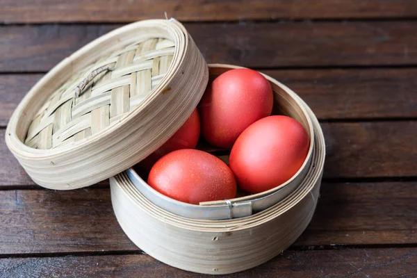 Red color eggs in dim sum tray. Red eggs are served in birthday celebration amongst Chinese as tradition