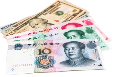 Close up of China Yuan Renminbi currency note against US Dollar clipart