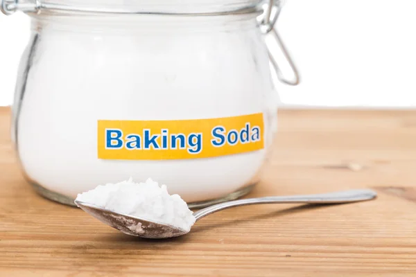 Jar and spoonful of baking soda for multiple holistic usages — Stock Photo, Image