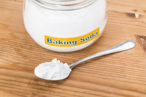 Jar and spoonful of baking soda for multiple holistic usages — Stock Photo, Image