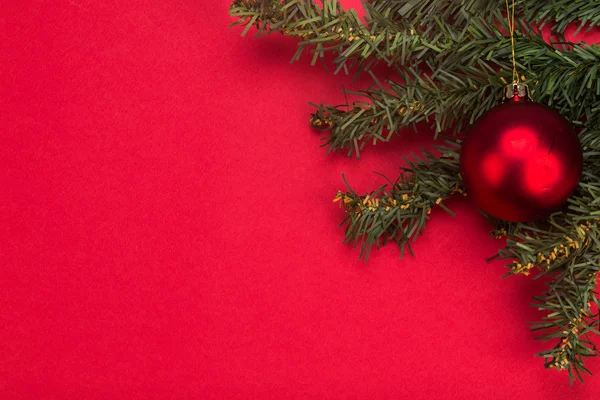 Simple red Christmas background with fir tree and ornaments. — Stock Photo, Image