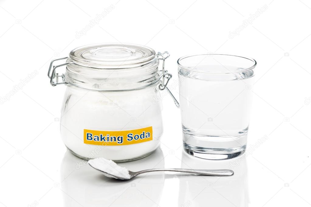 Baking soda in jar, spoonful and glass of water for multiple hol