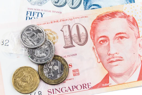 Close up on Singapore dollar currency notes and coins.