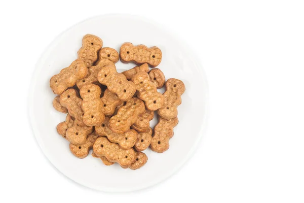 Biscotto a forma di arachide su piastra isolata in bianco — Foto Stock