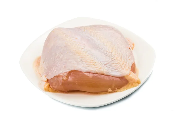 Fresh chicken breast meat with skin on plate — Stock Photo, Image