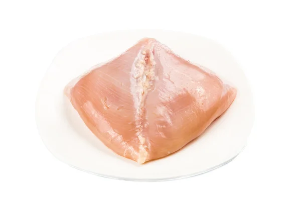Corazón en forma de carne de pechuga de pollo sin piel en un plato —  Fotos de Stock