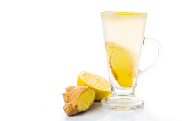 Estimular el té caliente de jengibre y limón en una taza y un frasco de filtro —  Fotos de Stock