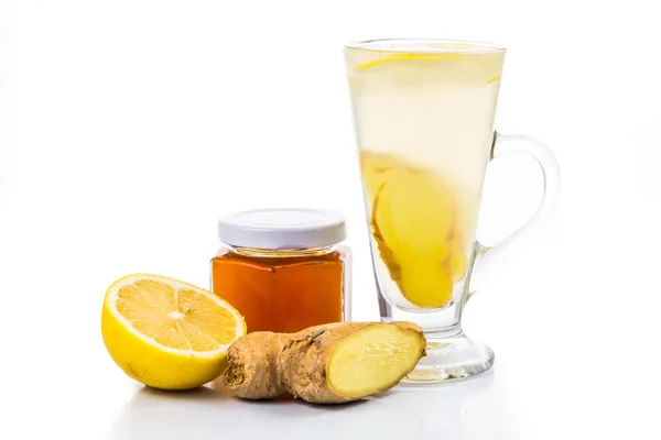 Stimulating Hot honey lemon and ginger drinks in tall transparent glass — Stock Photo, Image