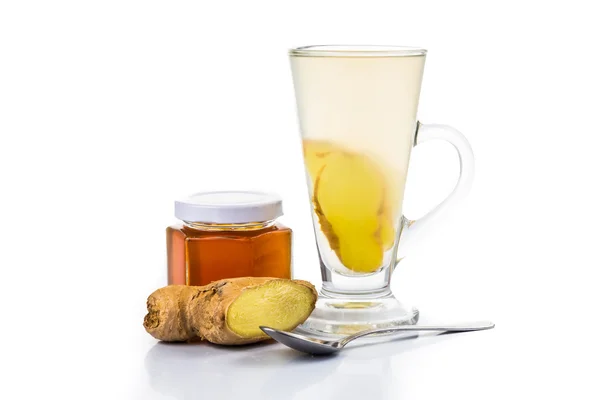 Stimulating Hot honey and ginger drinks in tall transparent glass — Stock Photo, Image