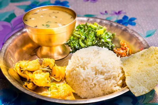 Dal Bhat, traditional Nepali meal platter with rice, lentils soup, vegetables, poppadum and spices. — Stock Photo, Image