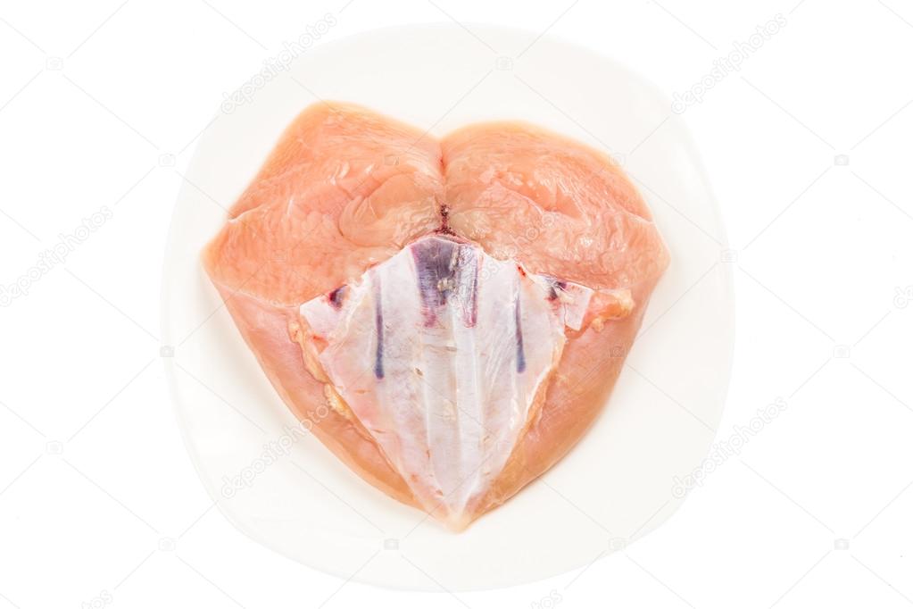 Fresh heart shaped skinless chicken breast meat with keel bone