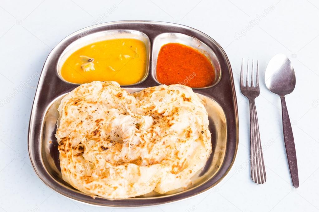 Roti Prata or Roti Canai, a traditional Indian bread served with curry