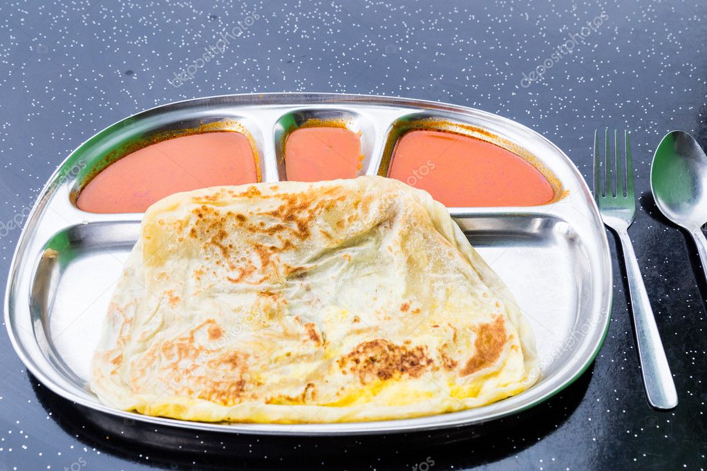 Roti Telur, a favorite Malaysian delicacy served with various curries