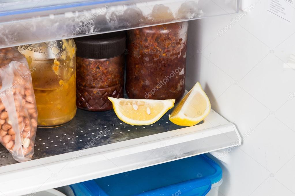 Cut lemons placed in refrigerator to deodorize smell